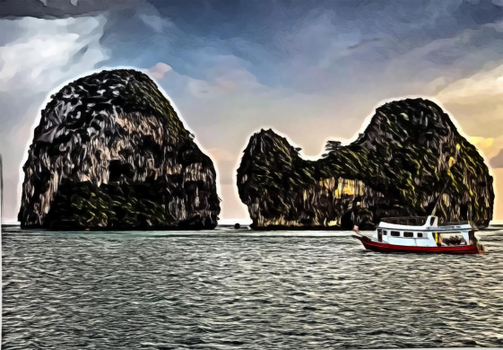 White Boat Sailing Near Islands during Golden Hour