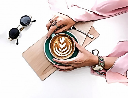 Woman Holding Cup of Latte