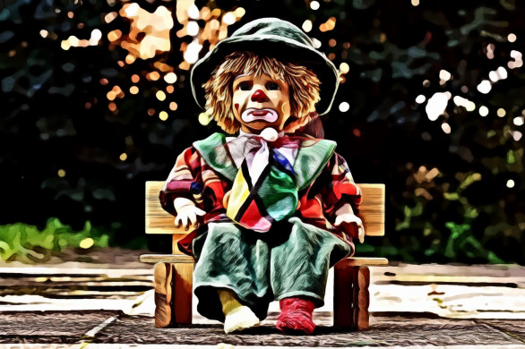 Clown Doll Sitting on Bench