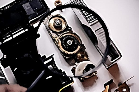 Magnifying Glass With Black Frame Over Camera Parts
