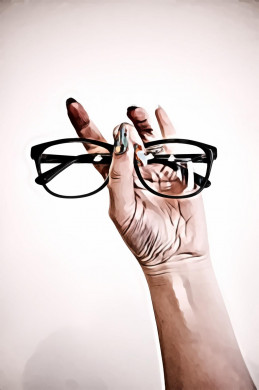 Photo of Person Holding Eyeglasses