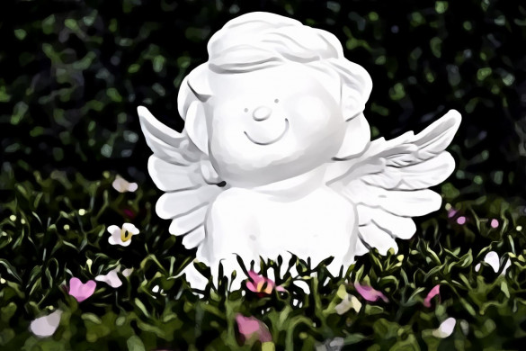 White Angel Ceramic Figurine on Green Grass With White and Purple Flower