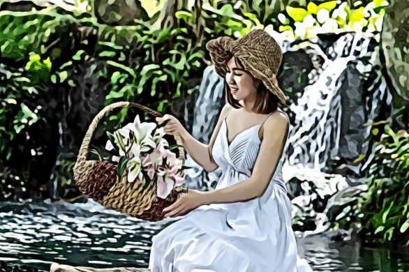 Woman Holding Basket While Sitting Near Waterfall