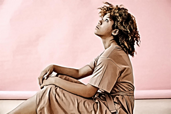 Woman in Brown Dress Sitting on Floor while Looking up.