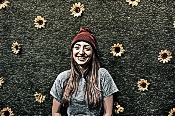 Woman Leaning On Wall With Sunflowers