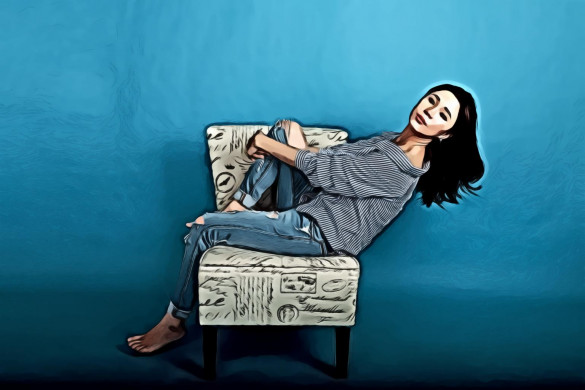 Woman Seating on Chair In Studio