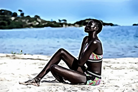 Woman Sitting on Beach Sands