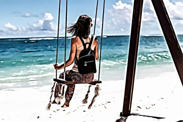 Woman Sitting on Seashore Swing