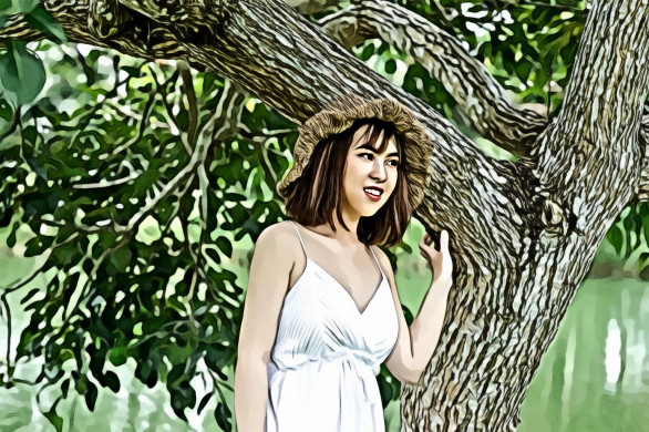 Woman Wearing Brown Hat Standing Under Green Tree