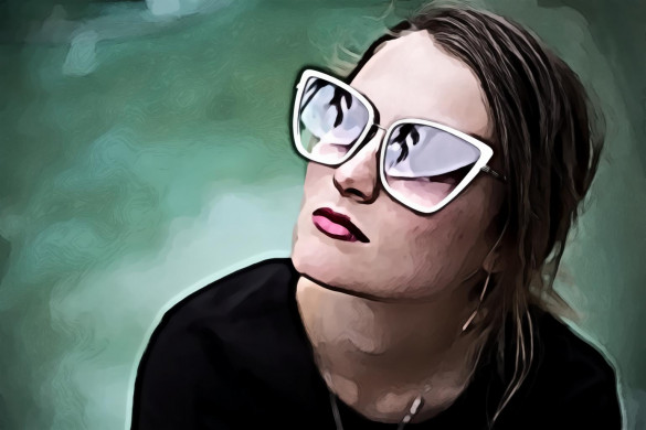 Woman Wearing Gray Framed Butterfly Sunglasses