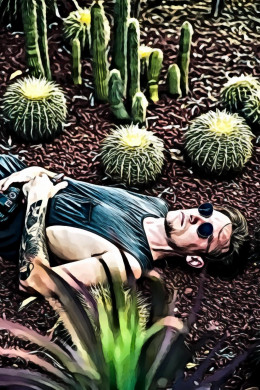 Man Lying On Ground Beside Cacti
