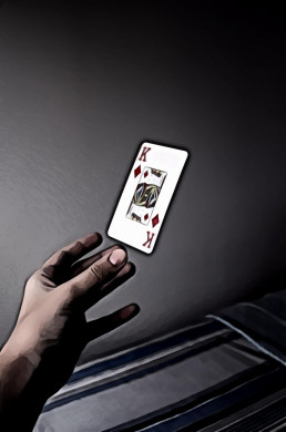 Person Holding King of Diamonds Playing Card