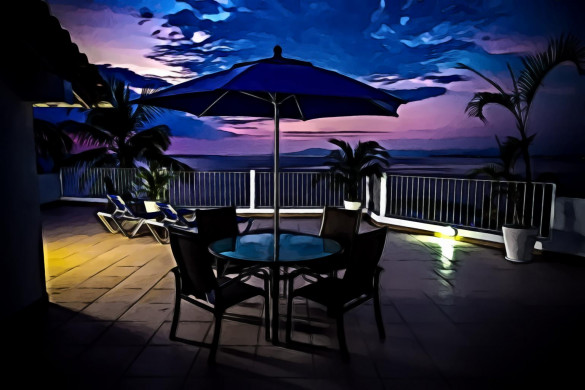 Round Metal Patio Near Railings at Night