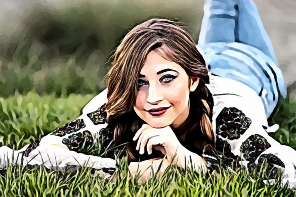 Woman Lying on Green Grass Field during Daytime