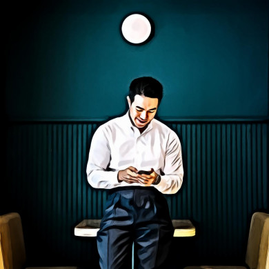 Man Holding Black Smartphone