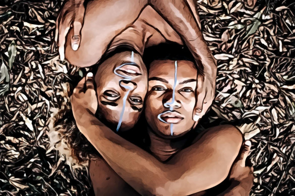 Two People Laying On Dry Leaves