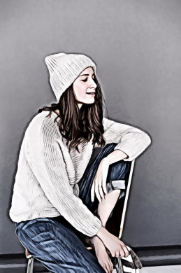 Woman in White Sweater and Beanie With Blue Denim Pants