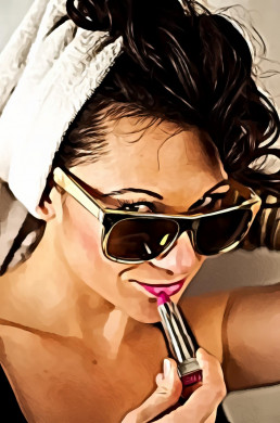 Woman Wearing Sunglasses Using Lipstick