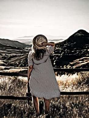 Woman Holding Brown Straw Hat