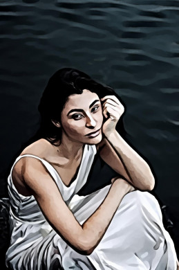 Woman Sitting Beside Body of Water