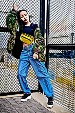 Woman Wearing Denim Jeans Standing Beside Chain-Link Fence