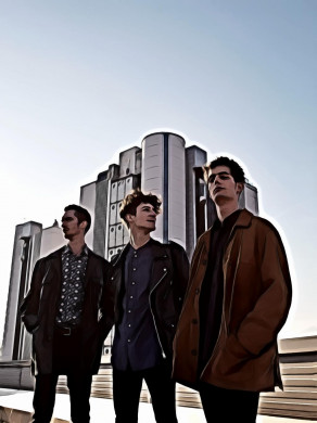 Three Men Standing on Top of Building