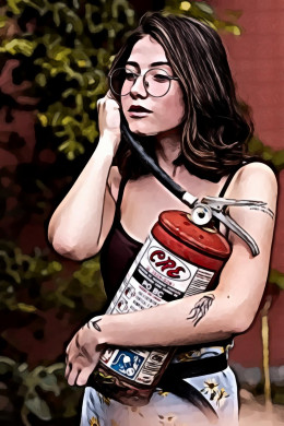 Woman in black spaghetti strap top holding fire extinguisher