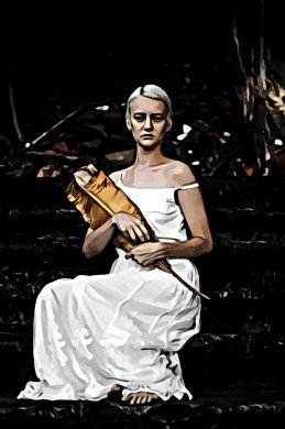 Woman in White Dress Sitting on Concrete Staircase Holding Dry Banana Leaf