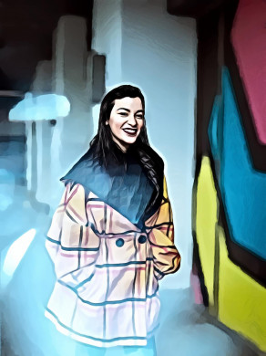 Woman Wearing Yellow Coat Smiling Near Wall