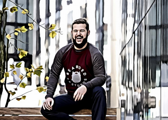 Man sitting on brown wooden bench