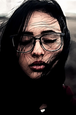 Portrait of woman in black framed eyeglasses with her eyes closed