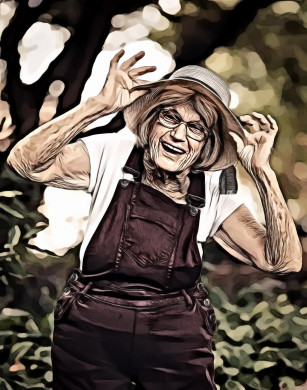 Selective focus portrait of woman standing near green plant