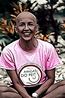 Smiling bald woman in pink t shirt sitting on ground