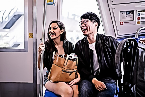 Smiling woman and man inside train