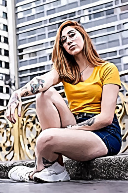 Woman sitting near gray high rise building