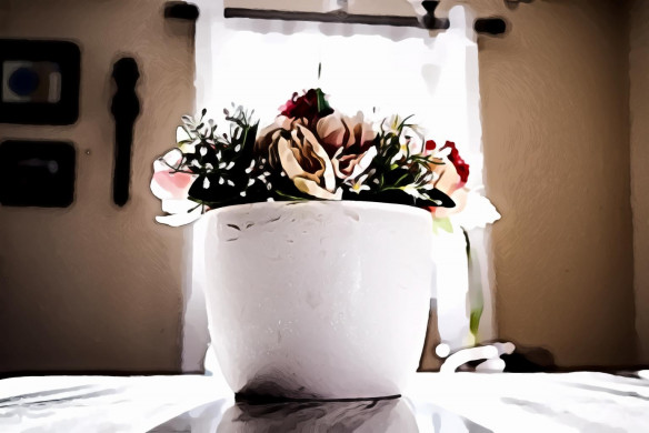 Assorted flowers in white ceramic vase