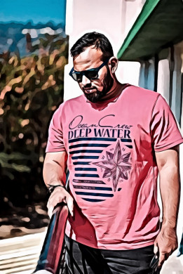 Man in red crew neck t shirt wearing sunglasses