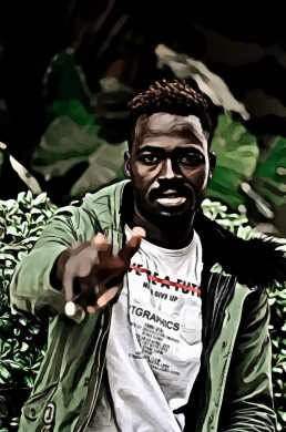 Man sitting next to green plant