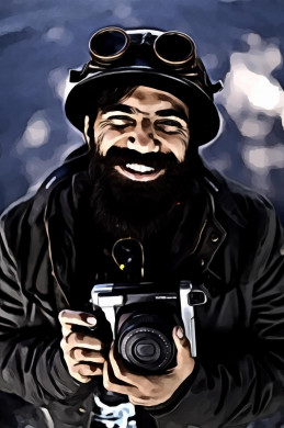 Man smiling holding camera