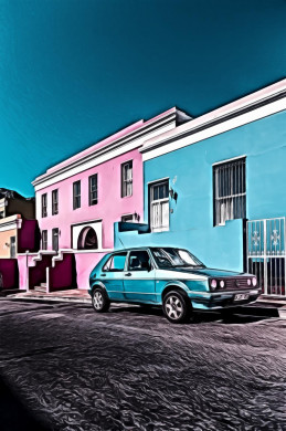 Parked blue car beside building