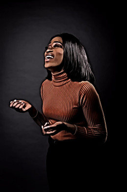 Woman in brown sweater laughing