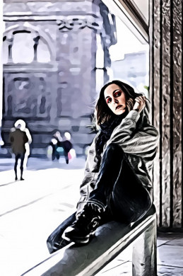 Woman in gray jacket and blue denim jeans sitting on gray metal bracket