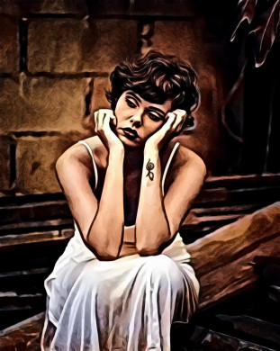 Woman sitting on wooden planks while resting her head on hands