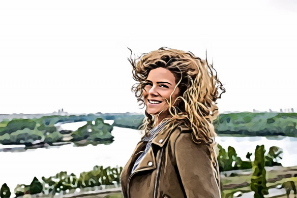 Woman wearing brown coat smiling