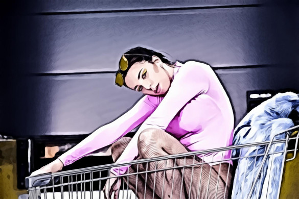 Woman wearing pink long sleeve shirt on shopping cart