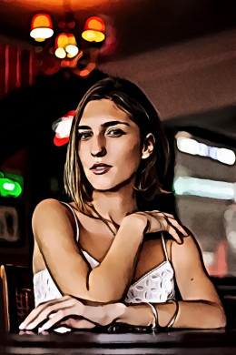 Woman wearing white spaghetti strap top siting by the table