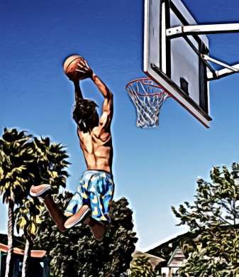 Man wearing blue and yellow shorts playing basketball