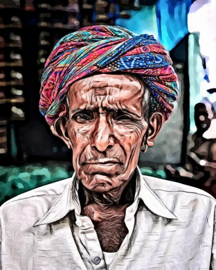 Portrait of an old man wearing headscarf