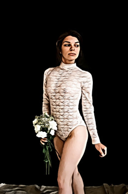 Woman in body suit carrying flowers