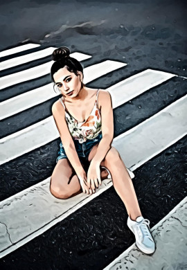 Woman in white green and orange floral spaghetti strap top sitting on pedestrian lane